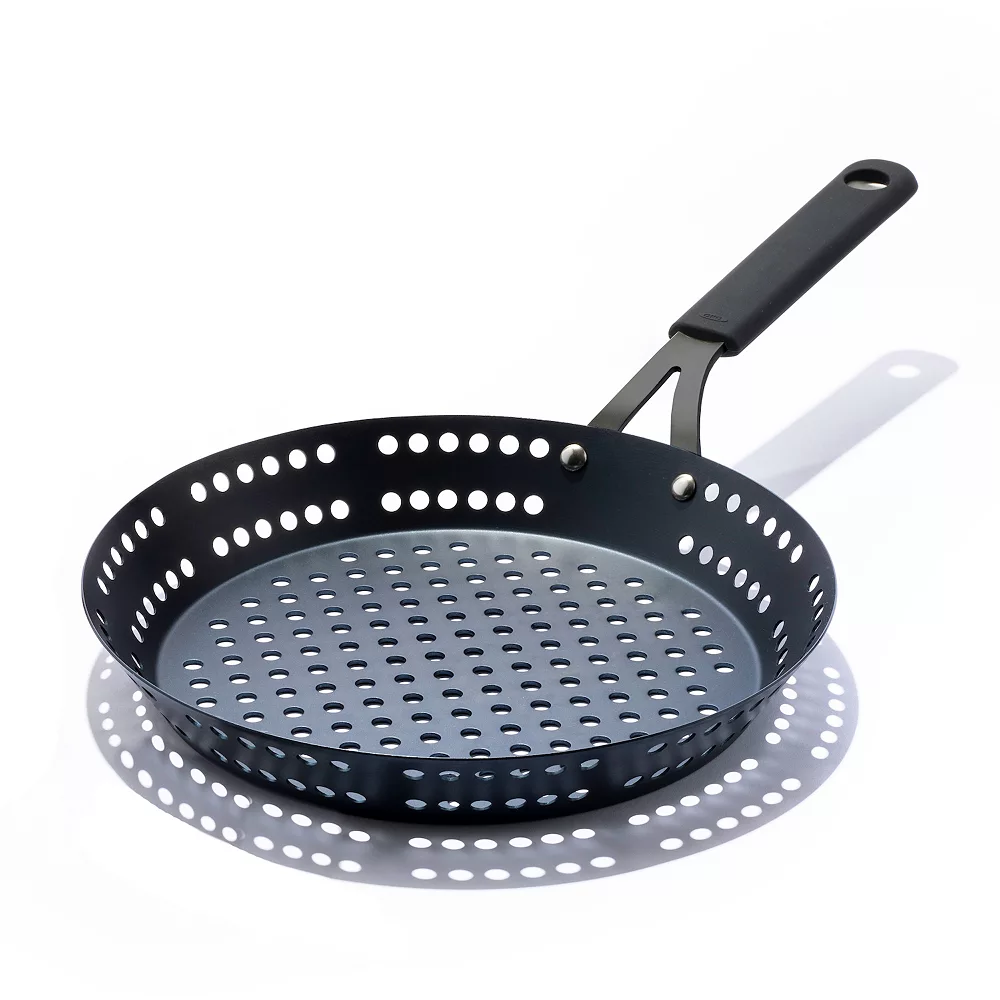 OXO Obsidian Pre-Seasoned Carbon Steel 12-in. Frypan With Holes For Grilling With Removable Silicone Handle Holder 3 OXO Obsidian Pre-Seasoned Carbon Steel 12-in. Frypan With Holes For Grilling With Removable Silicone Handle Holder